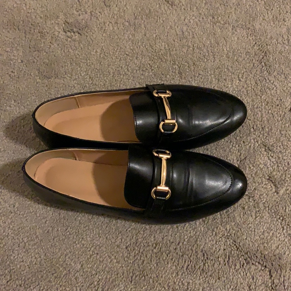 Black- “pleather” loafer with gold buckle.